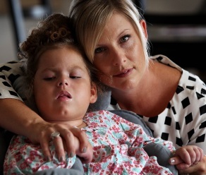 PICTURE BY NIC ELLIS 14 APRIL 2013 THE WEST AUSTRALIAN FAIRFAX AND AUSTRALIAN FINANCIAL REVIEW OUT Kirsten Button at home in Watermans with her four-year-old daughter Saba Button, who is a quadraplegic after suffering massive brain damage following the administration of a flu vaccination in 2010..